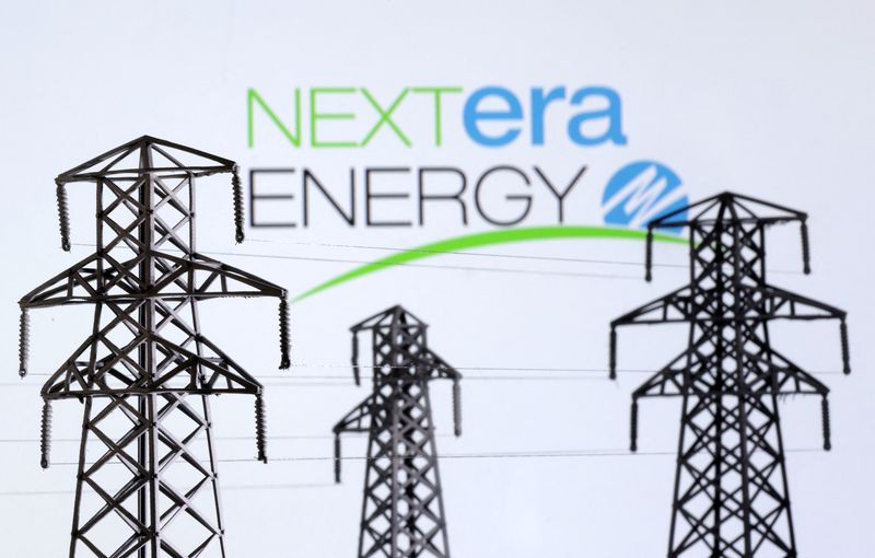 Electric power transmission pylon miniatures and Nextera Energy logo are seen in this illustration taken, December 9, 2022. REUTERS/Dado Ruvic/Illustration/File Photo