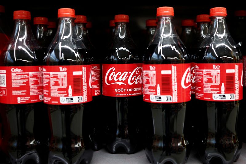 Bottles of Coca-Cola are displayed for sale on a shelf at a supermarket in Perros-Guirec, France, April 18, 2025. REUTERS/Benoit Tessier