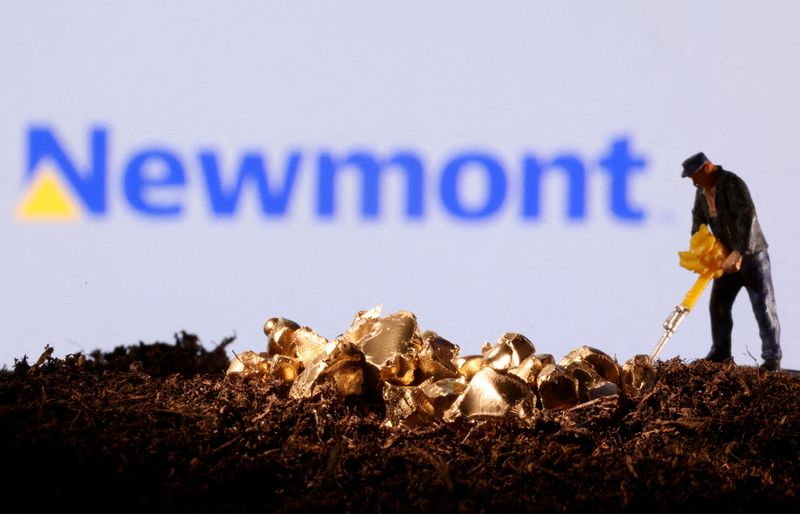 FILE PHOTO: A small toy figure and gold imitation are seen in front of the Newmont logo in this illustration taken November 19, 2021. REUTERS/Dado Ruvic/Illustration/File Photo