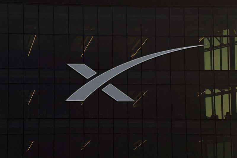 The SpaceX’s logo is seen in one of their buildings as the initial public offering (IPO) is expected to be announced soon in Starbase, Texas, U.S. March 31, 2026.  REUTERS/Gabriel V. Cardenas