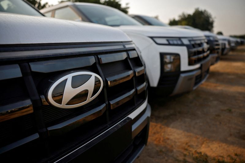 The Logo of Hyundai Motor India Limited is seen on a parked car in the company's stockyard, in the outskirts of Ahmedabad, India, October 8, 2024. REUTERS/Amit Dave