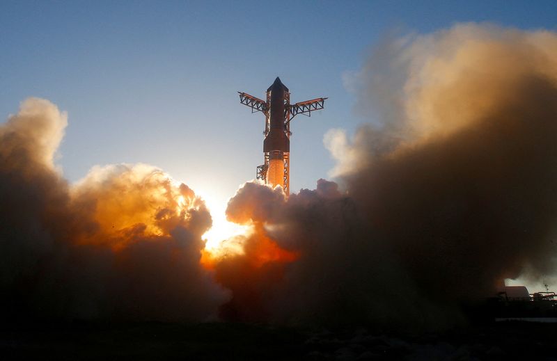 FILE PHOTO: A SpaceX Super Heavy booster carrying the Starship spacecraft lifts off on its 11th test flight at the company's launch pad in Starbase, Texas, U.S., October 13, 2025. REUTERS/Steve Nesius/File Photo