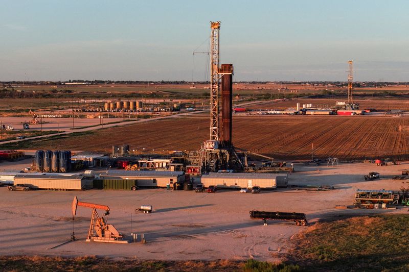 FILE PHOTO: A drone view of drilling rigs in Midland, Texas, U.S. June 11, 2025. REUTERS/Eli Hartman/File Photo