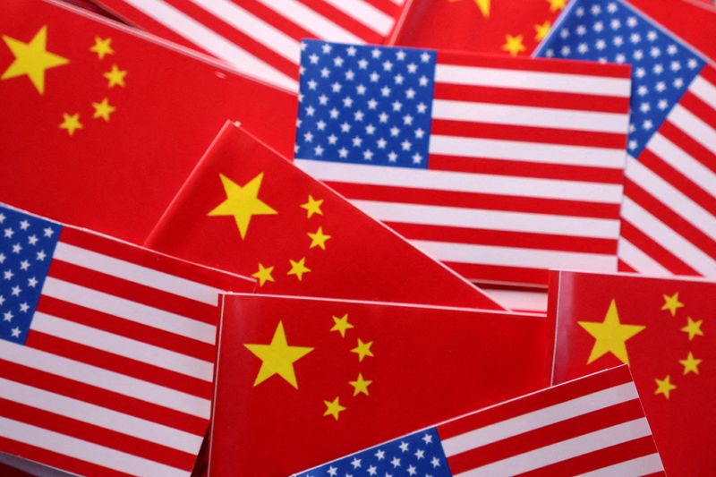 FILE PHOTO: U.S. and Chinese flags are seen in this illustration created on March 20, 2025. REUTERS/Dado Ruvic/Illustration/File Photo