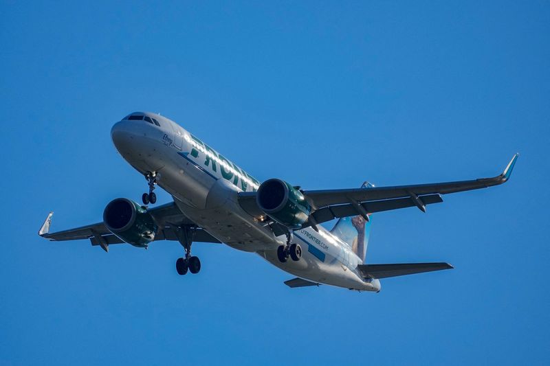 FILE PHOTO: A Frontier Airlines plane approaches Ronald Reagan Washington National Airport near Alexandria, Virginia, U.S., December 24, 2025. REUTERS/Ken Cedeno/File Photo