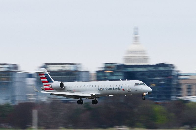 An American Airlines flight prepares to land at Ronald Reagan International Airport in Arlington, Virginia., U.S., March 15, 2026. REUTERS/Aaron Schwartz