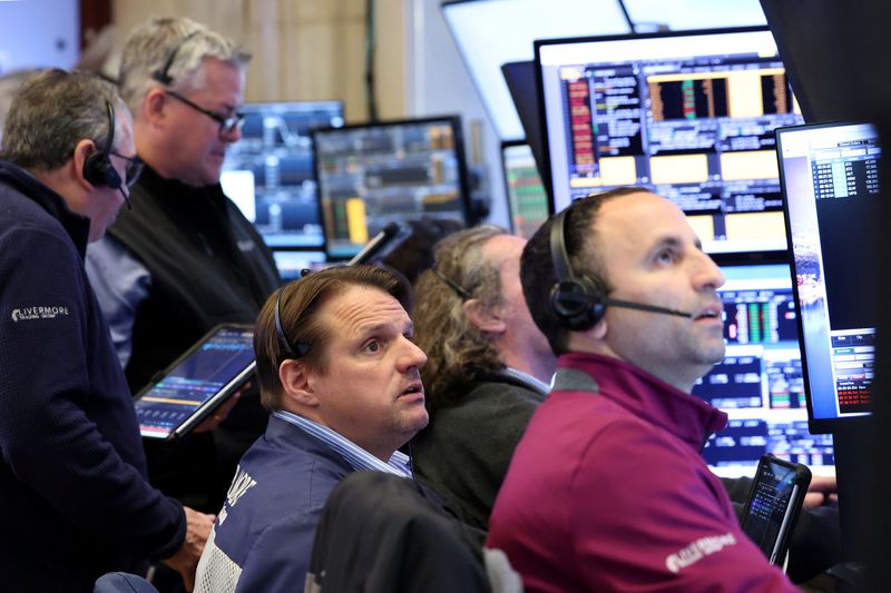 Traders work on the floor at the New York Stock Exchange (NYSE) in New York City, U.S., April 27, 2026.  REUTERS/Brendan McDermid