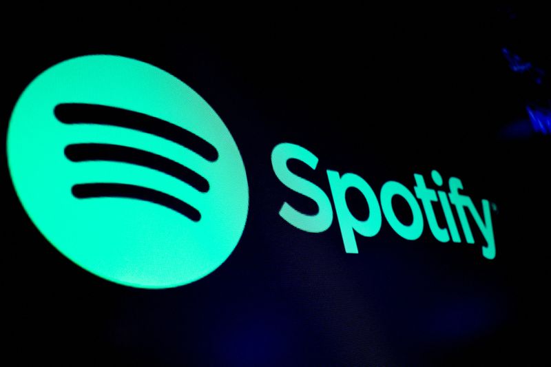 A screen displays the logo of Spotify on the floor at the New York Stock Exchange (NYSE) in New York City, U.S., December 4, 2023.  REUTERS/Brendan McDermid