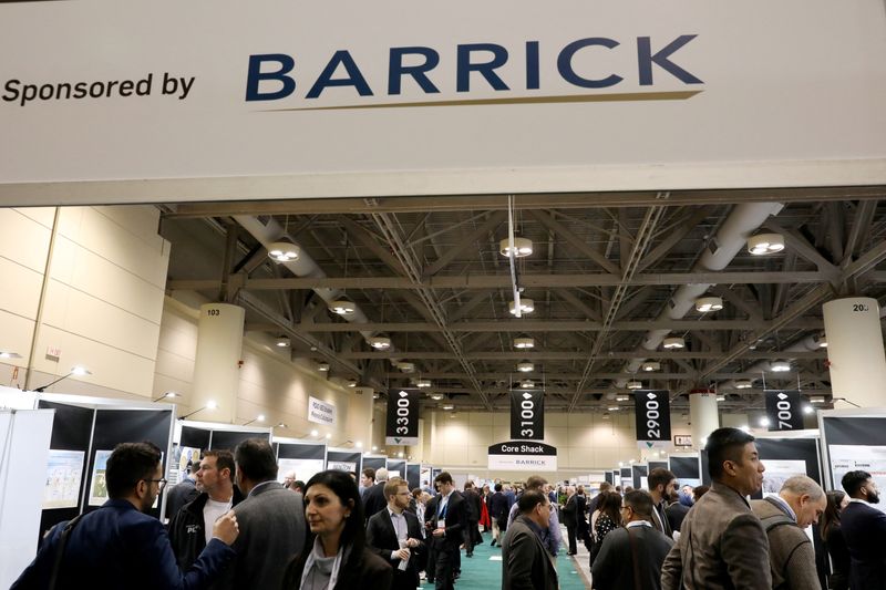 FILE PHOTO: People visit a section sponsored by Canadian headquartered mining company Barrick Gold Corporation at the Prospectors and Developers Association of Canada (PDAC) annual conference in Toronto, Ontario, Canada March 7, 2023. REUTERS/Chris Helgren/File Photo