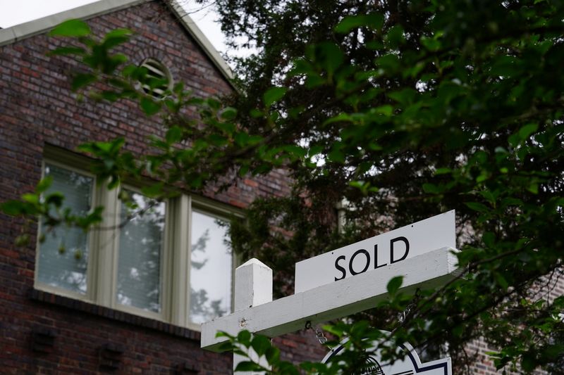 FILE PHOTO: A "sold" sign is seen outside of a recently purchased home in Washington, U.S., July 7, 2022. REUTERS/Sarah Silbiger/File Photo