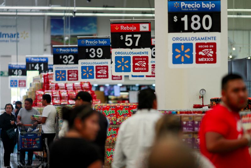 Logos of Made in Mexico are pictured as people search for products in a Walmart store in Mexico City, Mexico March 12, 2025. REUTERS/Henry Romero
