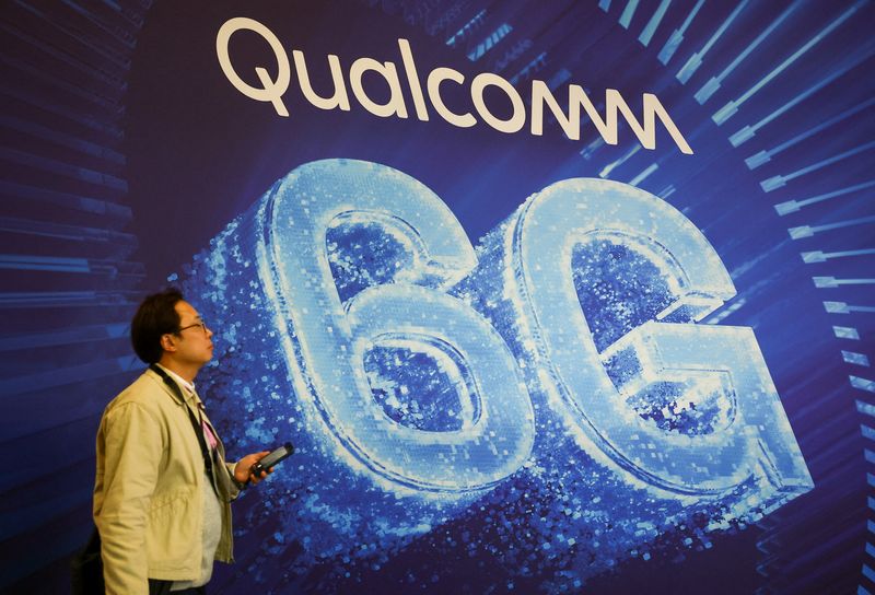 A man walks past Qualcomm 6G placard at the Mobile World Congress (MWC) at Fira de Barcelona, Spain, March 2, 2026. REUTERS/Albert Gea