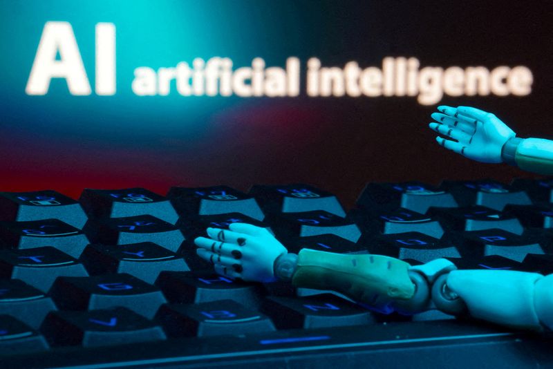 FILE PHOTO: A message reading "AI artificial intelligence," a keyboard and robot hands are seen in this illustration created on January 27, 2025. REUTERS/Dado Ruvic/Illustration/File Photo