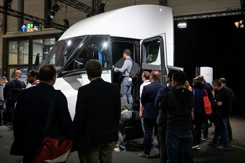 FILE PHOTO: Visitors queue to enter the Tesla Semi truck, a fully electric semi-trailer truck, at the booth of the U.S. carmaker at the IAA truck show in Hanover, Germany, September 17, 2024. REUTERS/Fabian Bimmer/File Photo
