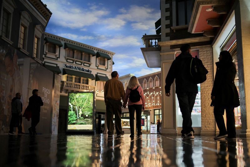 FILE PHOTO: People walk through a shopping mall at The Venetian Las Vegas resort, in Las Vegas, Nevada, U.S., November 18, 2025. REUTERS/Daniel Cole/File Photo