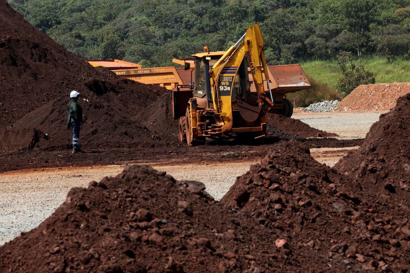 FILE PHOTO: A wheel loader operates at the blocks three and four of the Simandou mine, one of the largest high-grade iron ore deposits, run by Rio Tinto and partners' joint venture, SimFer, in the Nzerekore Region, Guinea November 5, 2025. REUTERS/Luc Gnago/ File Photo