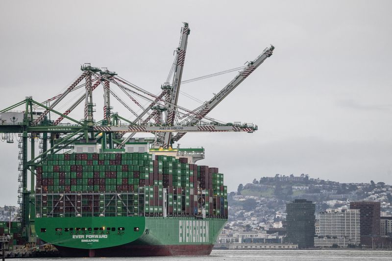 FILE PHOTO: Shipping containers are stacked on a cargo ship at the port of Oakland following the Supreme Court's ruling that Trump had exceeded his authority when he imposed tariffs, in Oakland, California, U.S., February 24, 2026. REUTERS/Carlos Barria/File Photo