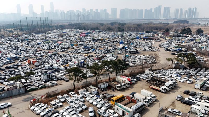 FILE PHOTO: A drone view of used cars that are mostly exported to countries in the Middle East remain parked at a used-car export complex in Incheon, South Korea, March 16, 2026.   REUTERS/Kim Hong-Ji/File Photo