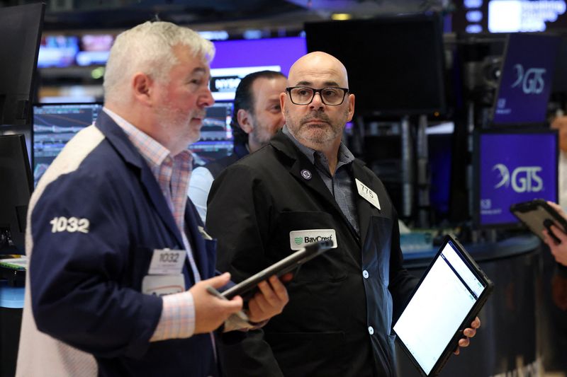 Traders work on the floor at the New York Stock Exchange (NYSE) in New York City, U.S., April 29, 2026.  REUTERS/Brendan McDermid