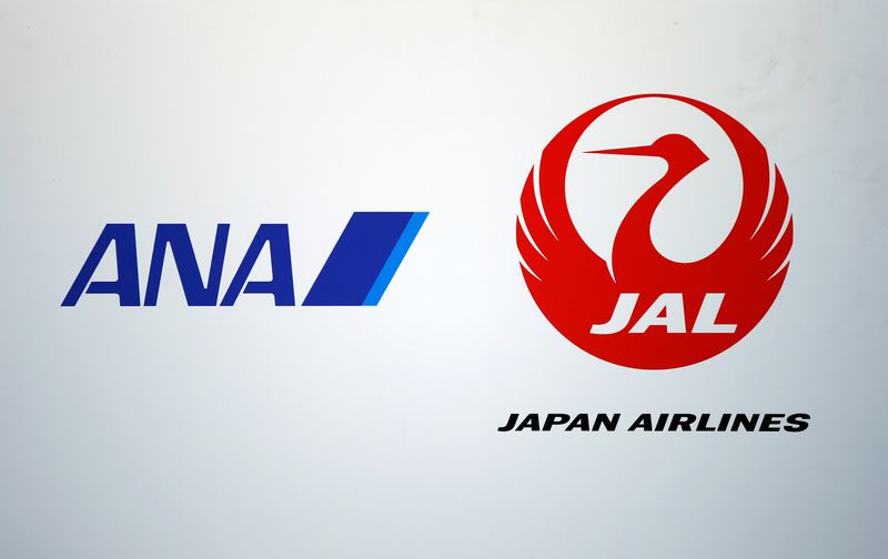 Logos of All Nippon Airways (ANA) Co and Japan Airlines (JAL) Co are seen at Haneda airport in Tokyo, Japan, October 14, 2016. REUTERS/Toru Hanai/File Photo