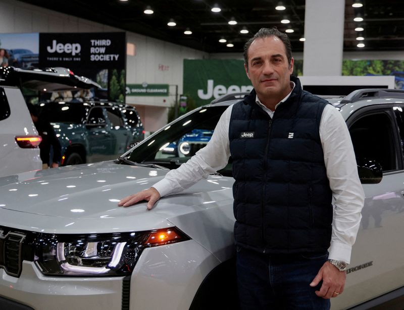 FILE PHOTO: Stellantis CEO Antonio Filosa poses by a Jeep Cherokee during media day of the Detroit Auto Show in Detroit, Michigan, U.S. January 14, 2026.  REUTERS/Rebecca Cook/File Photo
