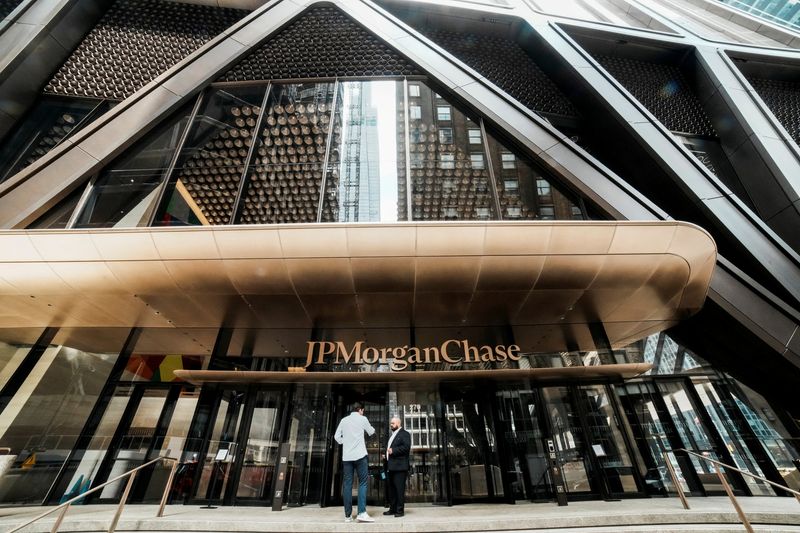 FILE PHOTO: People arrive to the JPMorgan Chase & Co., headquarters in New York City, U.S., April 1, 2026. REUTERS/Eduardo Munoz/File Photo