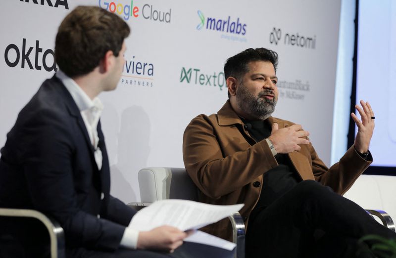 Justin Wexler, General Partner, WndrCo speaks with Netomi CEO Puneet Mehta at the Momentum AI summit in New York City, U.S., April 27, 2026.  Jim Hinson/Handout via REUTERS
