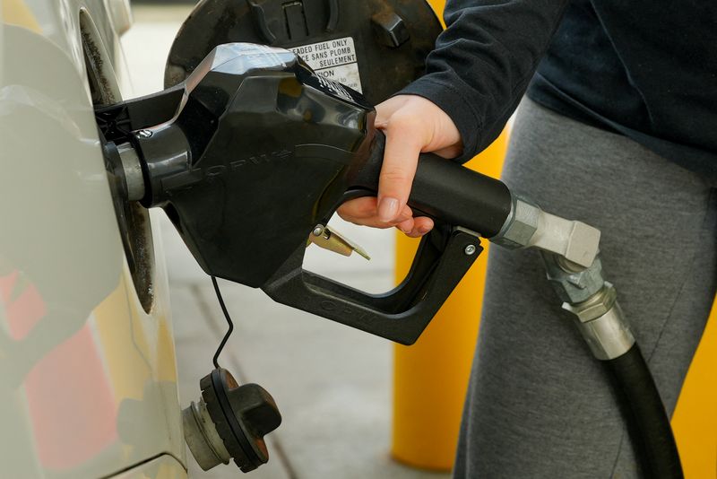 A woman pumps gas at a Shell station as the price of oil and gas has surged amid the U.S.-Israeli conflict with Iran, in Washington, D.C., U.S., March 5, 2026. REUTERS/Ken Cedeno