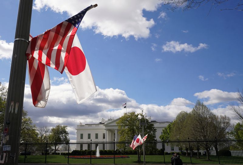 Japanese and U.S. flags fly side by side in front of the White House in Washington, U.S., April 5, 2024.  REUTERS/Kevin Lamarque