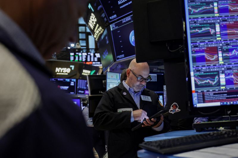 A trader works on the floor at the New York Stock Exchange (NYSE) in New York City, U.S., April 23, 2026. REUTERS/Jeenah Moon