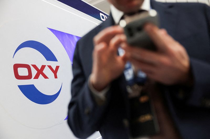 FILE PHOTO: A man walks past a logo of Occidental Petroleum during the annual energy industry event Abu Dhabi International Petroleum Exhibition and Conference (ADIPEC) in Abu Dhabi, United Arab Emirates, November 3, 2025. REUTERS/Amr Alfiky/File Photo