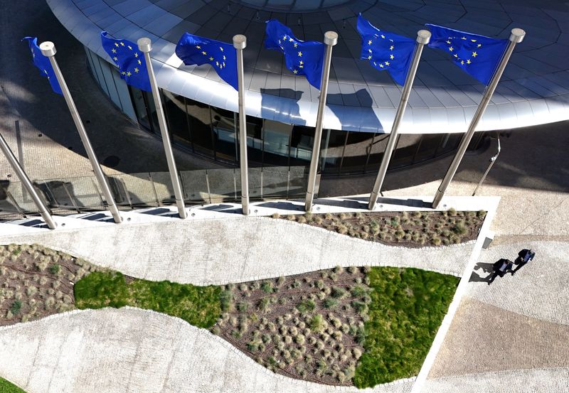FILE PHOTO: A drone view shows the European Union flags outside the European Commission headquarters, known as the Berlaymont building in Brussels, Belgium, April 29, 2026. REUTERS/Yves Herman/ File Photo