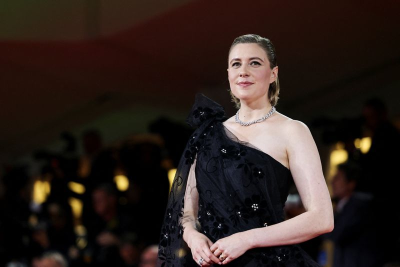 Cast member Greta Gerwig poses on the red carpet for the screening of the movie "Jay Kelly" in competition, at the 82nd Venice Film Festival, in Venice, Italy, August 28, 2025. REUTERS/Yara Nardi