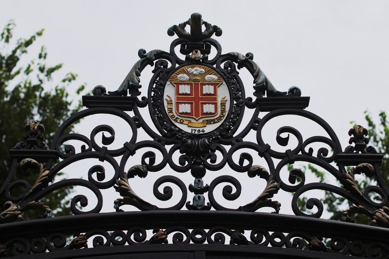 The seal of Brown University sits atop the Van Wickle Gates at the edge of the main campus in Providence, Rhode Island, U.S., August 16, 2022. REUTERS/Brian Snyder