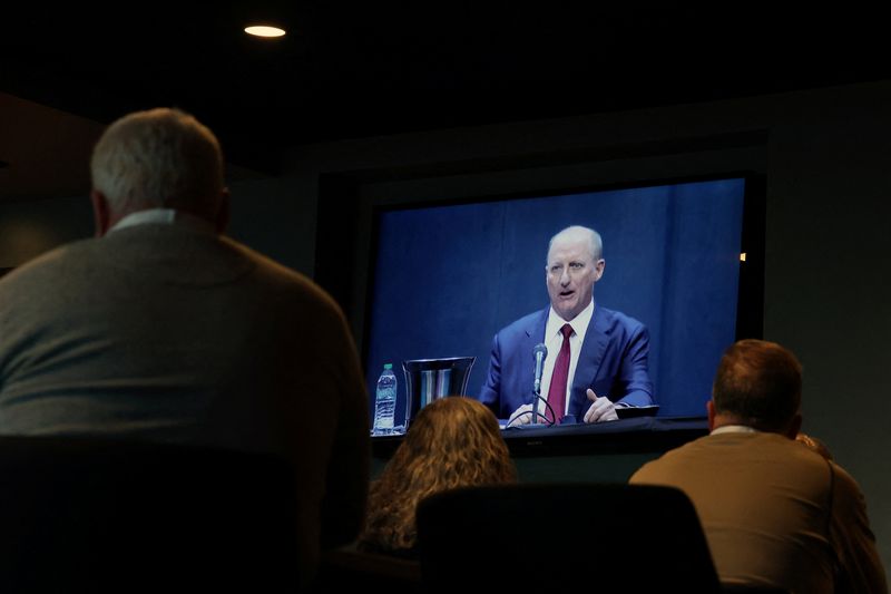 Shareholders watch a screen as Berkshire Hathaway CEO Greg Abel addresses the Berkshire Hathaway Inc’s annual shareholders meeting, the conglomerate’s first since Warren Buffett stepped down after 60 years as chief executive and was succeeded by Abel, in Omaha, Nebraska, U.S., May 2, 2026. REUTERS/Brendan McDermid