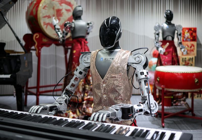 An ensemble of humanoid robots produced by Linkerbot is set up with musical instruments at the company’s office in Beijing, China, April 27, 2026. REUTERS/Maxim Shemetov