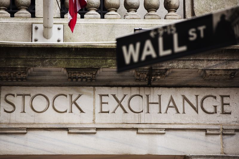 A street sign for Wall Street hangs in front of the New York Stock Exchange May 8, 2013. Stocks pushed further into record territory on Wednesday, driving the S&P 500 to an all-time high close for a fifth day, helped by strength in financials and technology. REUTERS/Lucas Jackson (UNITED STATES - Tags: BUSINESS)