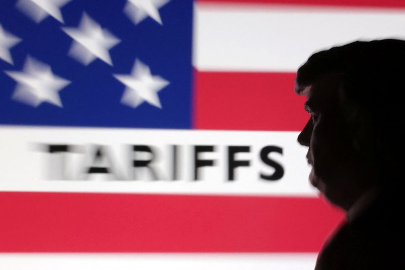 A 3D-printed miniature model of U.S. President Donald Trump and the U.S. flag pattern with the word "tariffs" are seen in this illustration taken April 7, 2025. REUTERS/Dado Ruvic/Illustration