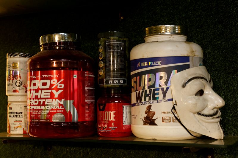 FILE PHOTO: Boxes of whey protein are displayed on a shelf in a gym in New Delhi, India, January 15, 2025. REUTERS/Priyanshu Singh/File Photo