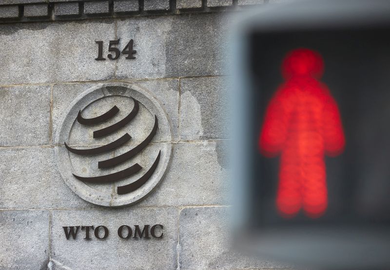 FILE PHOTO: A logo is pictured on the World Trade Organisation (WTO) building before a ministerial meeting to discuss a draft agreement on curbing subsidies for the fisheries industry in Geneva, Switzerland, July 15, 2021. REUTERS/Denis Balibouse/File Photo