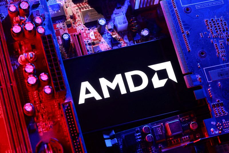 FILE PHOTO: An AMD logo and a computer motherboard appear in this illustration created on August 25, 2025. REUTERS/Dado Ruvic/Illustration/File Photo