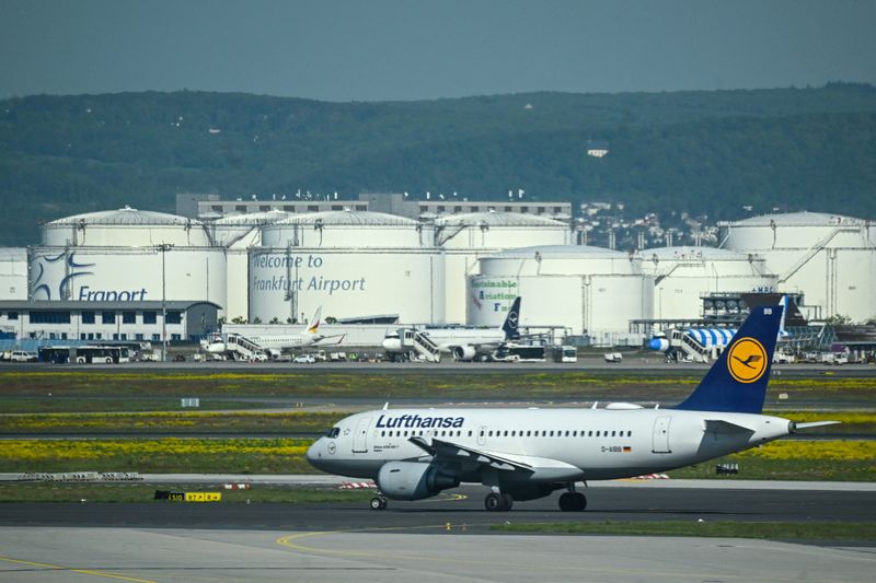 A Lufthansa plane moves on the runway near Kerosene tanks on the day of the official inauguration ceremony of Terminal 3 at Frankfurt Airport, in Frankfurt, Germany, April 22, 2026. REUTERS/Jana Rodenbusch/File Photo