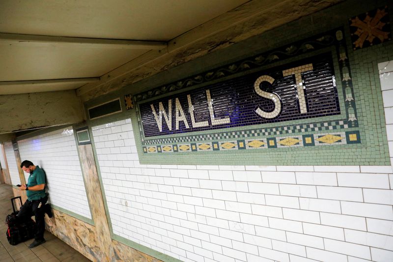FILE PHOTO: A person waits on the Wall Street subway platform in the Financial District of Manhattan, New York City, U.S., August 20, 2021. REUTERS/Andrew Kelly/File Photo