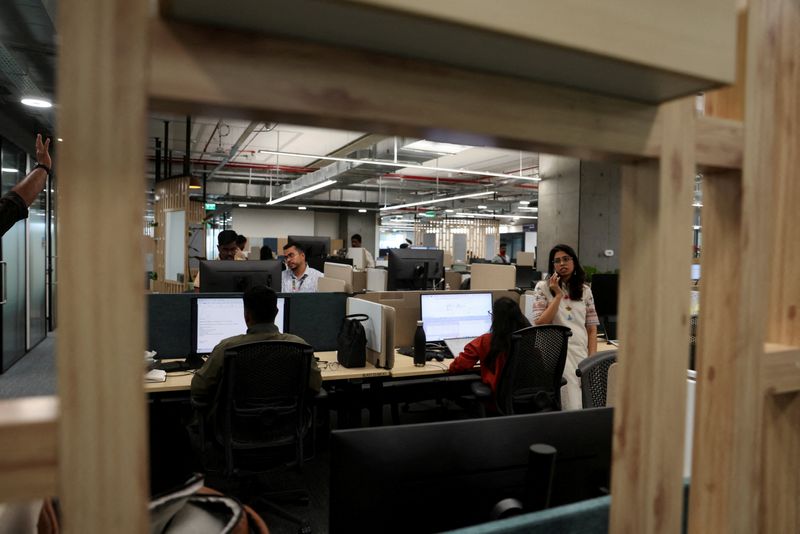 FILE PHOTO: Employees of Amazon work inside their newly inaugurated office in Bengaluru, India, February 23, 2026, REUTERS/Priyanshu Singh/File Photo