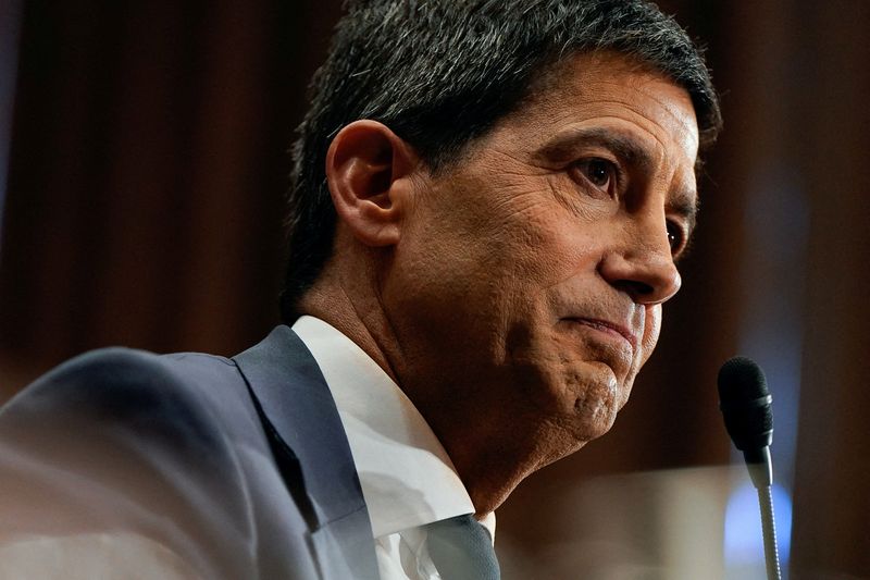 FILE PHOTO: Kevin Warsh, U.S. President Donald Trump's nominee to be next chair of the Federal Reserve, attends a Senate Banking Committee confirmation hearing to testify, on Capitol Hill in Washington, D.C., U.S., April 21, 2026. REUTERS/Elizabeth Frantz/File Photo