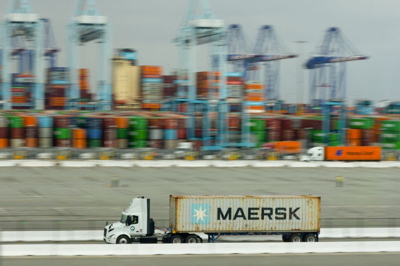 FILE PHOTO: A truck transports a Maersk container at APM Terminals at the Port of Los Angeles, California, U.S., March 4, 2026.   REUTERS/Mike Blake/File Photo