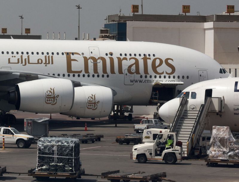 An Emirates aircraft is seen through the window of a Middle East Airlines airplane at Cairo International Airport in Cairo, Egypt, March 31, 2026. REUTERS/Amr Abdallah Dalsh