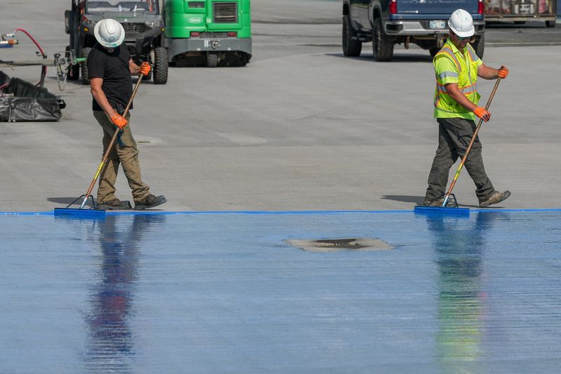 FILE PHOTO: Workers continue renovations on the Lincoln Memorial Reflecting Pool, which is painted blue, in Washington, D.C., U.S., May 2, 2026. REUTERS/Ken Cedeno/ File Photo