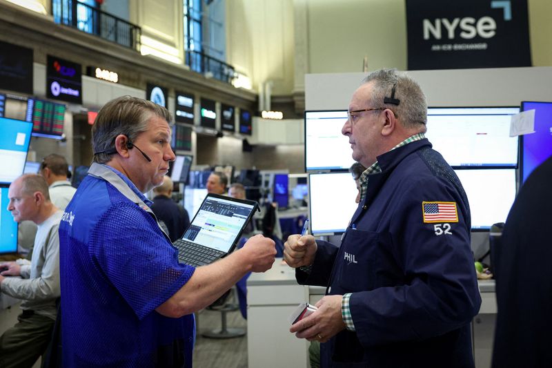 FILE PHOTO: Futures-options traders work on the floor at the New York Stock Exchange's NYSE American (AMEX) in New York City, U.S., May 5, 2026.  REUTERS/Brendan McDermid/ File Photo