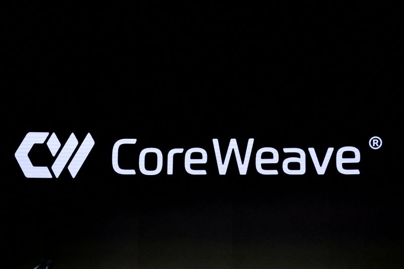 FILE PHOTO: A screen displays the company logo for CoreWeave, Inc., Nvidia-backed cloud services provider, during the company's IPO at the Nasdaq Market, in New York City, U.S., March 28, 2025. REUTERS/Brendan McDermid/File Photo